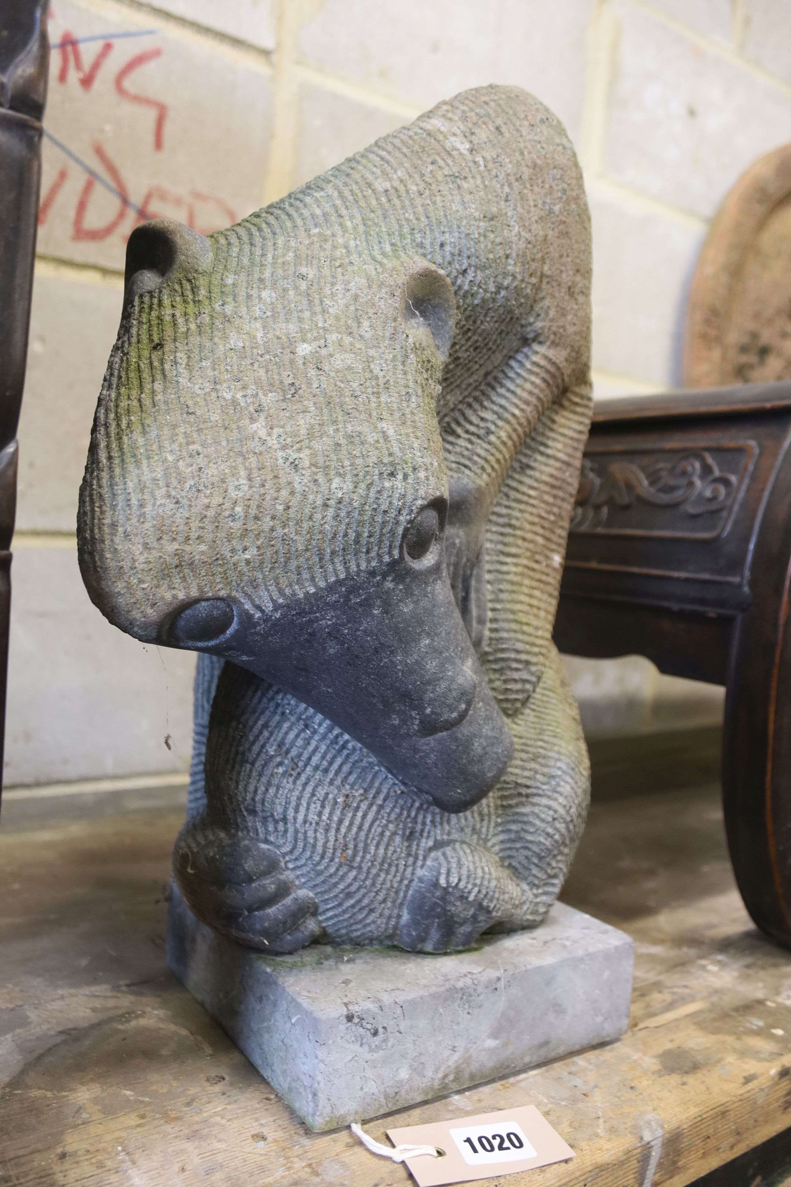 An African carved stone sculpture of an anteater, height 44cm